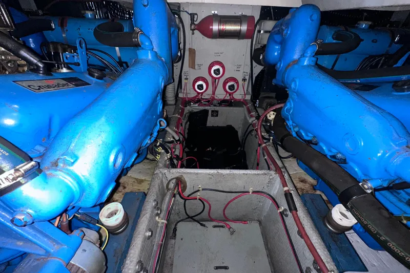 Slide: The Image of Engine room of a 1988 Silverton 37 Convertible with blue Crusader engines. - 36