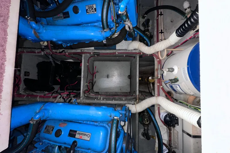 Slide: The Image of Engine room of 1988 Silverton 37 Convertible with blue Crusader engines and wiring. - 41