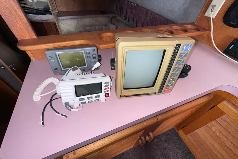 Slide: The Image of 1988 Silverton 37 Convertible boat electronics, featuring vintage radar and communication devices. - 47