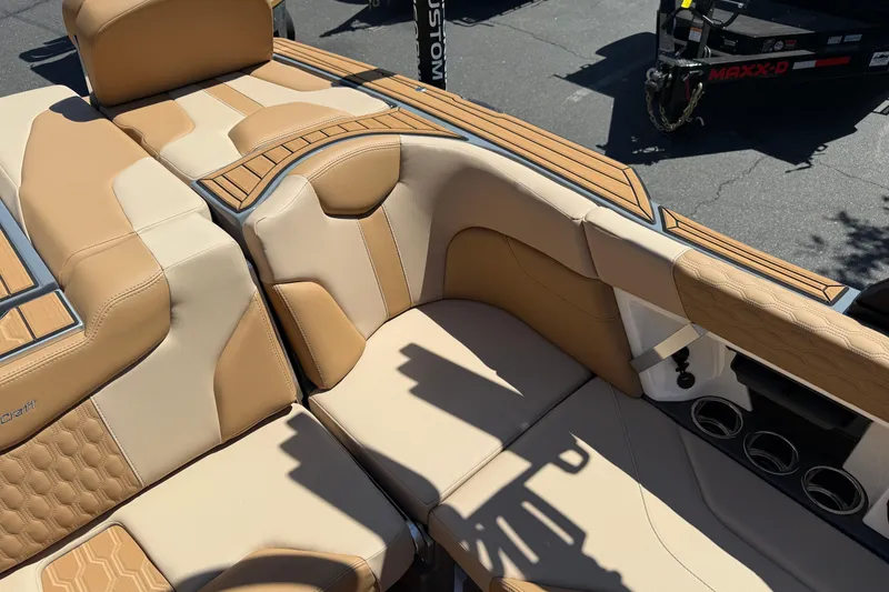 Slide: The Image of Luxurious interior of 2025 MasterCraft XT22 boat with tan leather seating. - 22