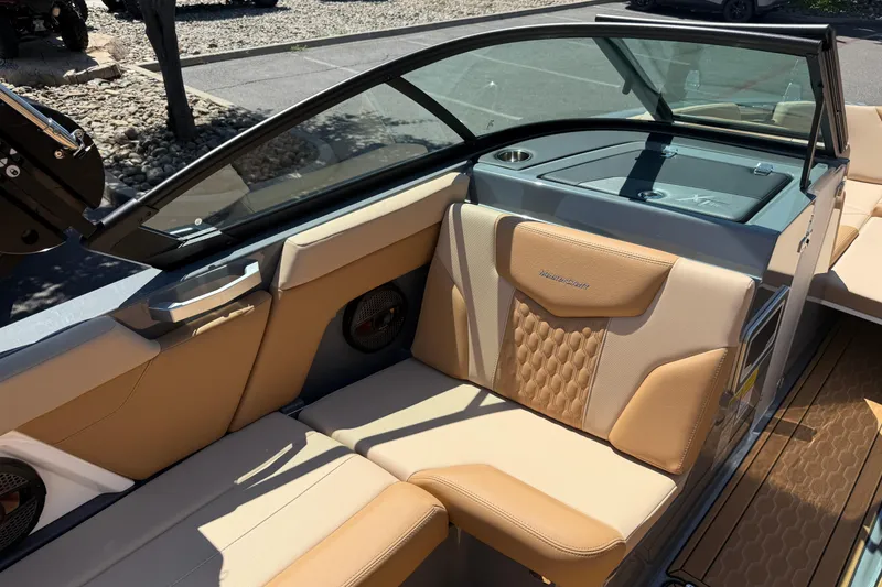 Slide: The Image of 2025 MasterCraft XT22 boat interior with tan leather seating and modern design. - 25