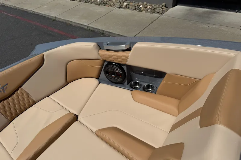 Slide: The Image of Luxurious interior of 2025 MasterCraft XT22 boat with beige and tan seating. - 29