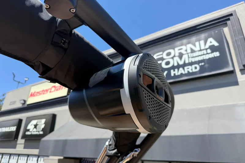 Slide: The Image of 2025 MasterCraft XT22 boat speaker with dealership signage in the background. - 30