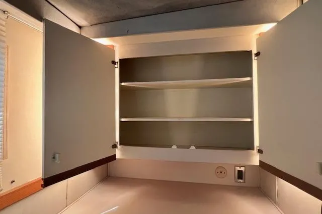 Slide: The Image of Empty cabinet interior on 1989 Trojan 12 Meter Motor Yacht. - 12