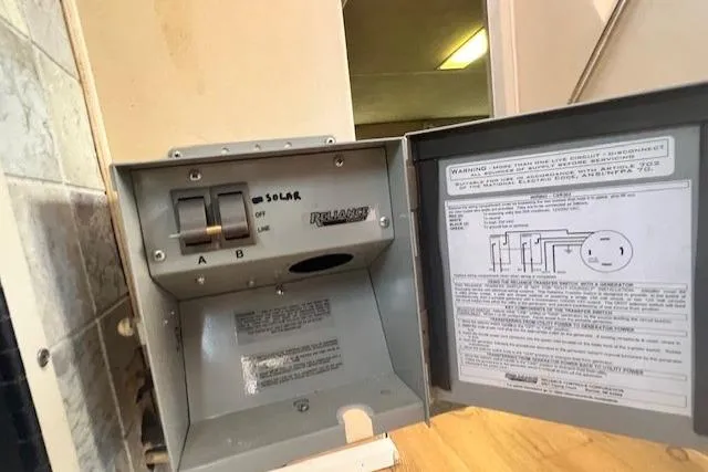 Slide: The Image of Electrical panel with solar switch in a 1989 Trojan 12 Meter Motor Yacht. - 13