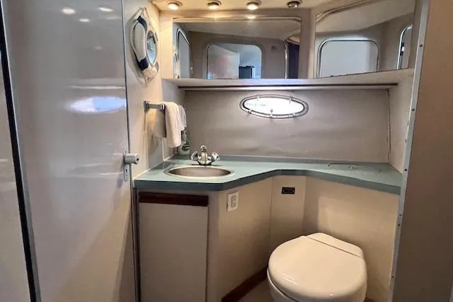 Slide: The Image of Luxurious bathroom in 1989 Trojan 12 Meter Motor Yacht with sink and toilet. - 24