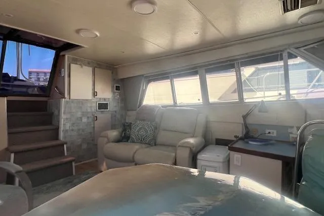 Slide: The Image of Interior of 1989 Trojan 12 Meter Motor Yacht with seating and windows. - 26