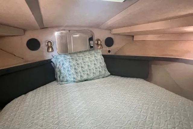 Slide: The Image of Cozy cabin interior of 1989 Trojan 12 Meter Motor Yacht with bed and lighting. - 27