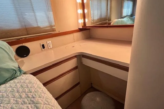 Slide: The Image of 1989 Trojan 12 Meter Motor Yacht interior with vanity, mirror, and lighting. - 35