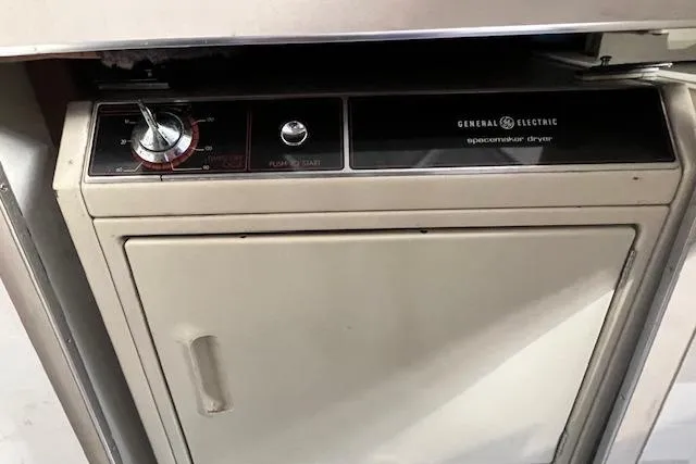 Slide: The Image of General Electric spacemaker dryer in a 1989 Trojan 12 Meter Motor Yacht. - 39