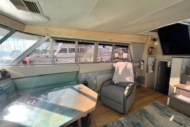 Slide: The Image of Interior of 1989 Trojan 12 Meter Motor Yacht with seating and windows. - 53