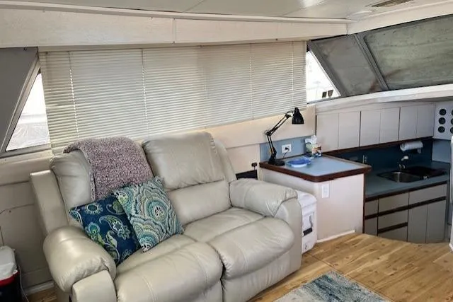 Slide: The Image of Interior of 1989 Trojan 12 Meter Motor Yacht with cozy seating and kitchenette. - 57
