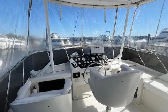 Slide: The Image of 1989 Trojan 12 Meter Motor Yacht cockpit with steering wheel and navigation equipment. - 7