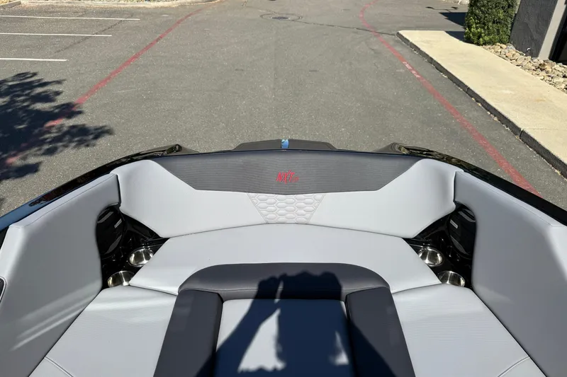 Slide: The Image of 2026 MasterCraft NXT24 boat interior with sleek gray seating and modern design. - 26