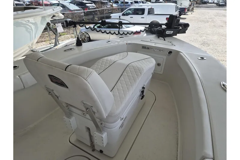 Slide: The Image of 2026 Ranger 2600 Bay boat interior with cushioned seating and fishing equipment. - 5