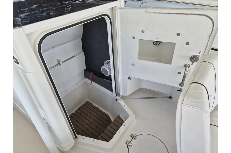 Slide: The Image of Interior view of 2026 Ranger 2600 Bay boat cabin with open hatch and seating. - 8