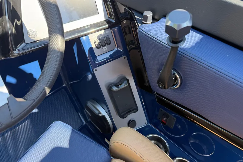 Slide: The Image of Interior controls of 2026 MasterCraft NXT23 boat, featuring steering wheel and dashboard. - 14
