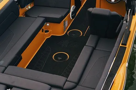 Slide: The Image of Manufacturer Provided Image: 2026 MasterCraft NXT23 boat interior with black seating and orange accents. - 4
