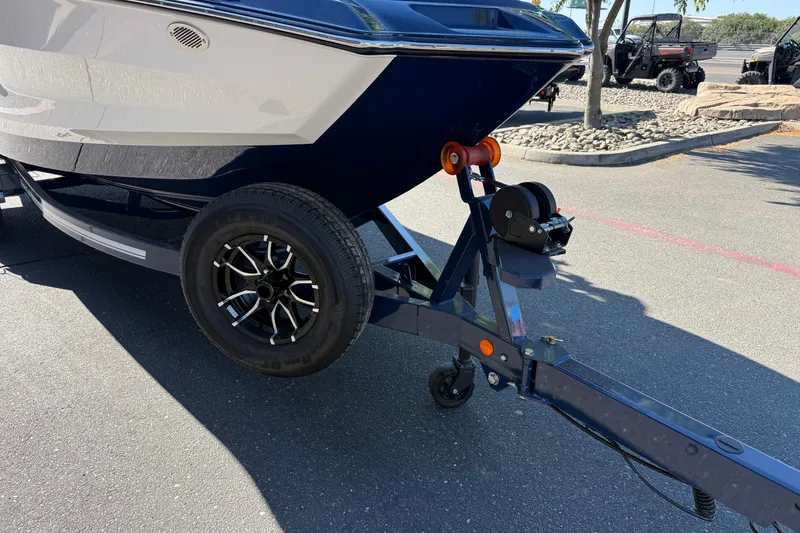 Slide: The Image of Trailer with 2026 MasterCraft NXT23 boat in parking lot. - 9