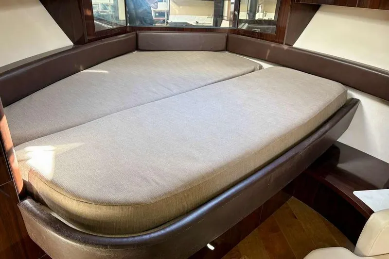 Slide: The Image of Interior cabin of 2018 Sea Ray Sundancer 350 Coupe with cushioned seating. - 13