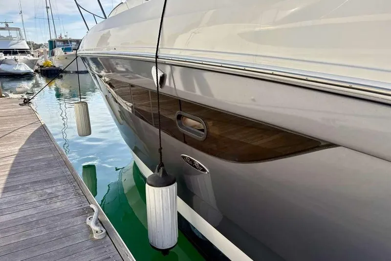 Slide: The Image of 2018 Sea Ray Sundancer 350 Coupe docked at marina with fenders. - 20
