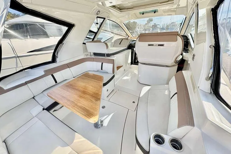 Slide: The Image of Luxurious interior of 2018 Sea Ray Sundancer 350 Coupe with elegant seating and wooden table. - 5
