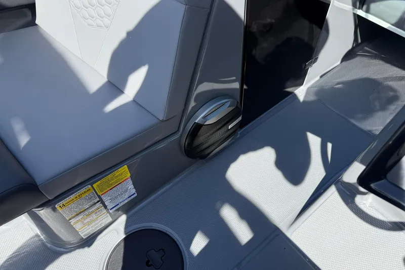Slide: The Image of Interior of 2026 MasterCraft NXT22 boat with seating and speaker detail. - 23