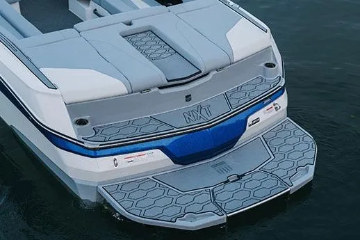 Slide: The Image of Manufacturer Provided Image: 2026 MasterCraft NXT22 boat rear view with sleek design and modern detailing. - 5