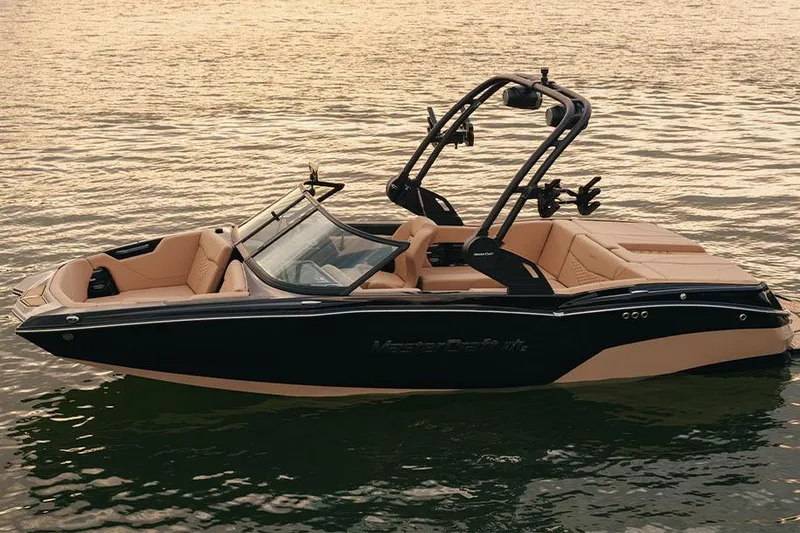 Slide: The Image of Manufacturer Provided Image: 2026 MasterCraft NXT20 boat on water, featuring sleek design and luxurious interior. - 2