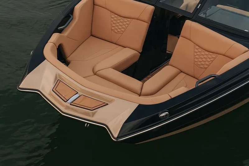 Slide: The Image of Manufacturer Provided Image: 2026 MasterCraft NXT20 boat with luxurious tan seating on calm water. - 3