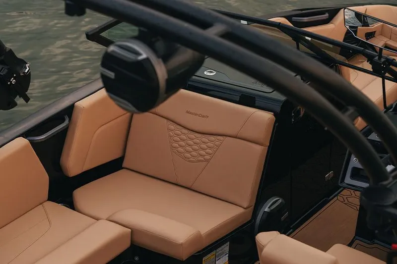 Slide: The Image of Manufacturer Provided Image: 2026 MasterCraft NXT20 boat interior with tan leather seating and modern design. - 4