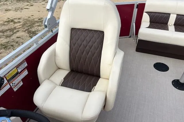 Slide: The Image of Luxurious seating on 2022 Lexington HP320 boat with beige and brown upholstery. - 5