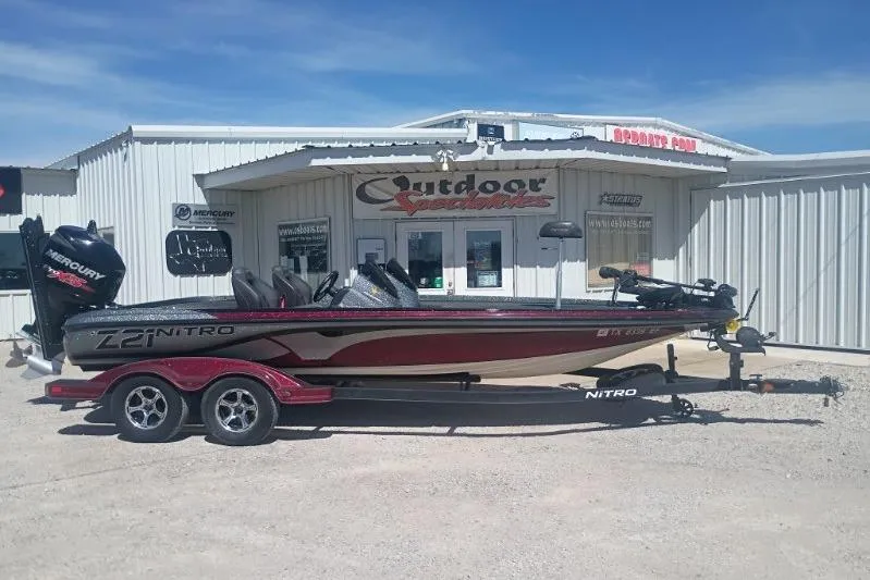The Image of 2048 Nitro Z21 Pro boat parked outside Outdoor Specialties store. - 1