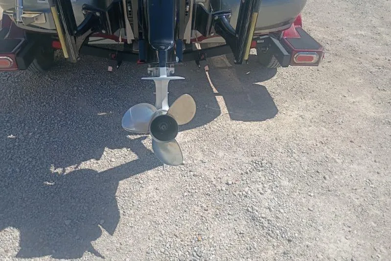 Slide: The Image of Propeller of a 2048 Nitro Z21 Pro boat on a gravel surface. - 10