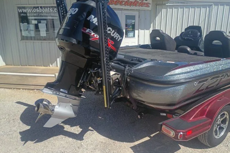 Slide: The Image of 2048 Nitro Z21 Pro boat with Mercury engine, parked outside a building. - 9