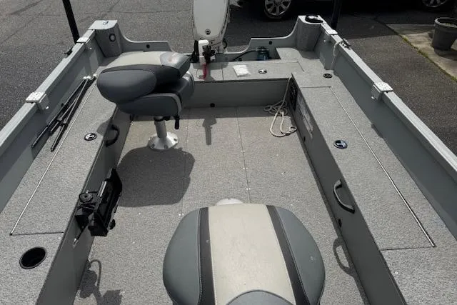 Slide: The Image of 2020 Alumacraft Summit 180 boat interior with seating and fishing rod holders. - 10