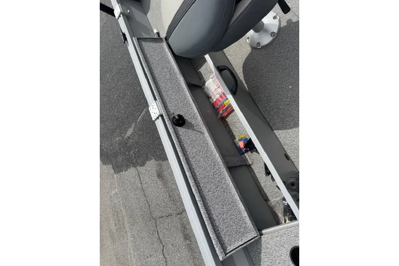 Slide: The Image of 2020 Alumacraft Summit 180 boat interior with storage compartment and seat. - 13