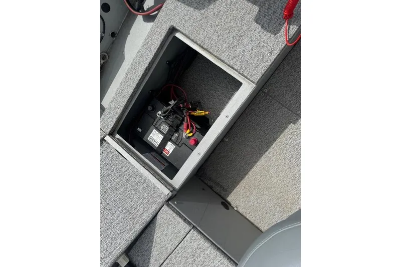 Slide: The Image of Battery compartment of 2020 Alumacraft Summit 180 boat with wiring visible. - 14