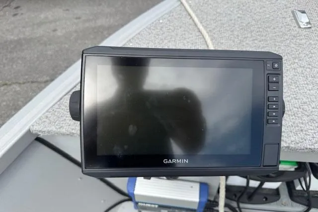 Slide: The Image of Garmin device on 2020 Alumacraft Summit 180 boat dashboard, featuring a sleek design. - 17