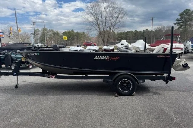 Slide: The Image of 2020 Alumacraft Summit 180 boat on trailer in outdoor dealership lot. - 3