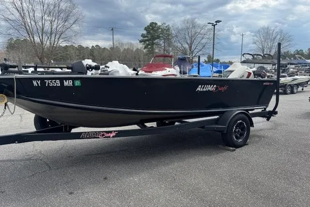 Slide: The Image of 2020 Alumacraft Summit 180 boat on trailer in outdoor setting. - 4