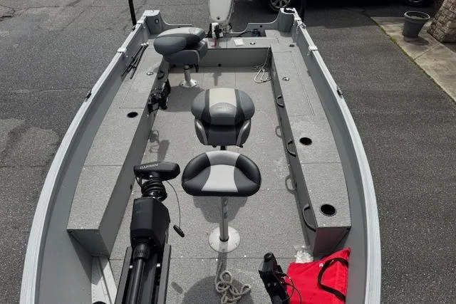 Slide: The Image of 2020 Alumacraft Summit 180 boat interior with seating and fishing equipment. - 8