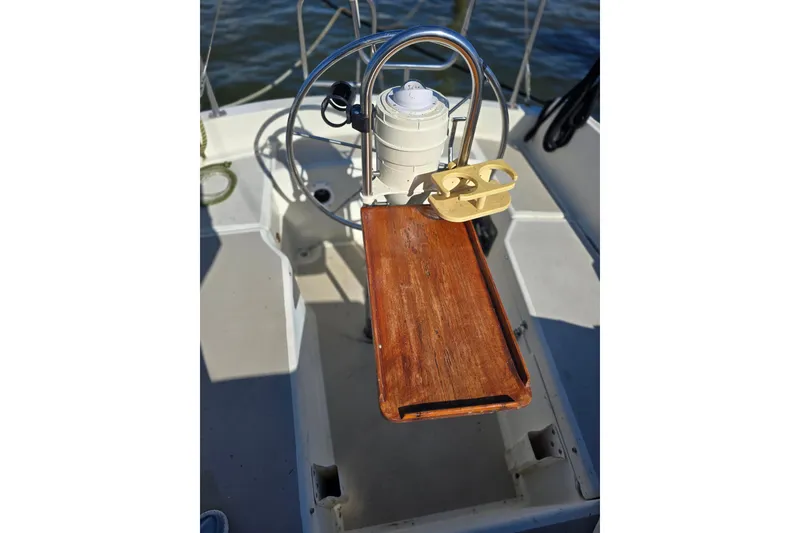 Slide: The Image of Cockpit of 1985 O'Day 31 sailboat with wooden table and steering wheel. - 13