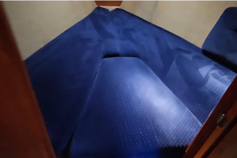 Slide: The Image of Interior cabin of 1985 O'Day 31 sailboat with blue upholstery. - 23