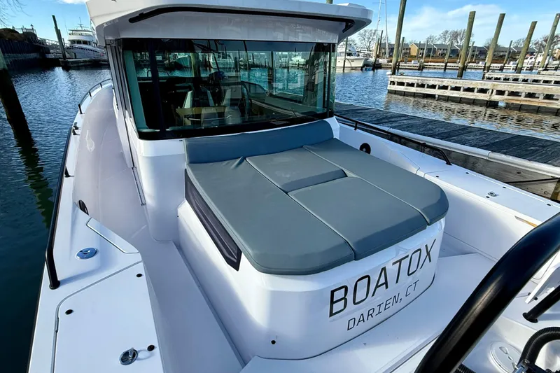 Slide: The Image of 2023 Axopar 37 Cross Cabin boat docked in Darien, CT marina. - 21