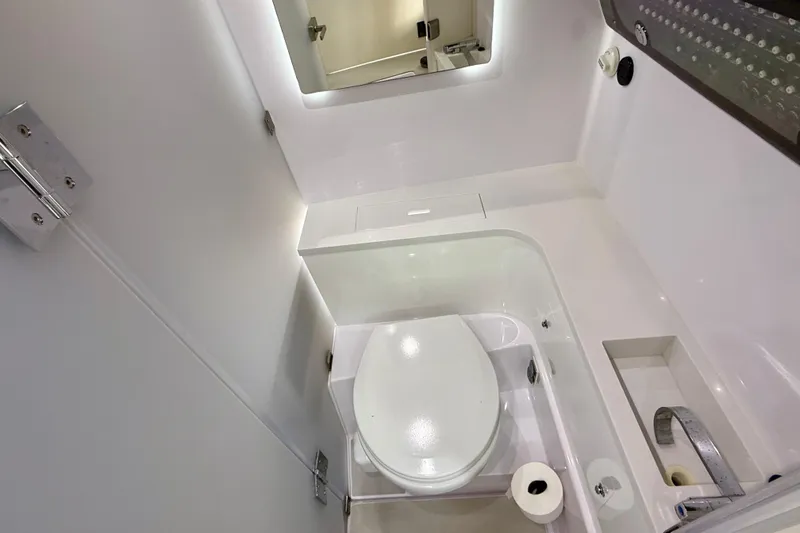 Slide: The Image of 2023 Axopar 37 Cross Cabin bathroom with modern fixtures and sleek design. - 30