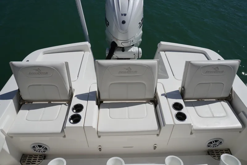 Slide: The Image of 2024 Regulator 26XO boat seats with cup holders, showcasing sleek design and comfort. - 42