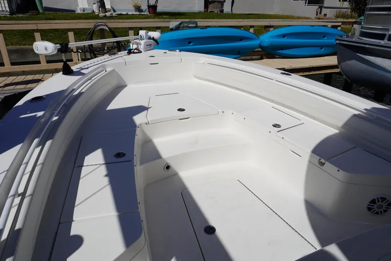 Slide: The Image of 2024 Regulator 26XO boat interior with spacious seating and storage compartments. - 51