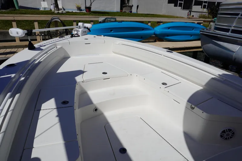 Slide: The Image of 2024 Regulator 26XO boat interior with seating and storage compartments. - 52