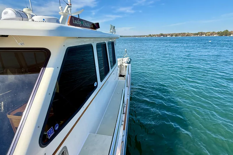 Slide: The Image of 2006 Sabre 42 Sedan yacht on clear blue water, sunny day. - 17